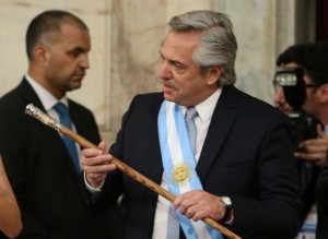 Argentina's President Alberto Fernandez holds the symbolic leader's staff after he was sworn in as Argentina's next president, in Buenos Aires, Argentina December 10, 2019.